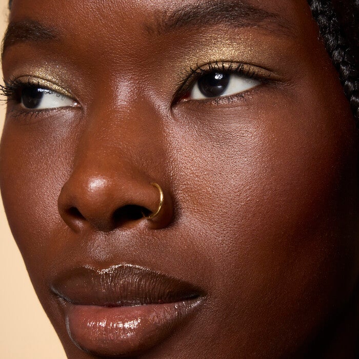 Model Wearing It's Gilt Gold Glitter Eyeshadow